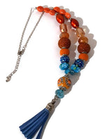 Blue leather tassel, statement beaded necklace, handmade necklace, boho chic style, The orange peacock necklace.